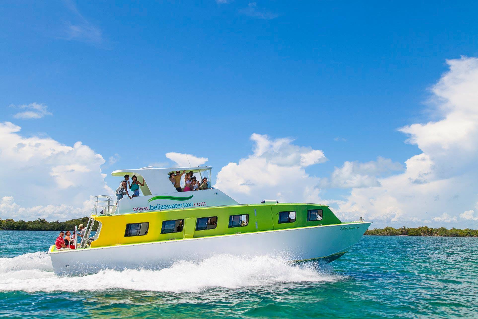 Charter catamaran with guests on the upper deck
