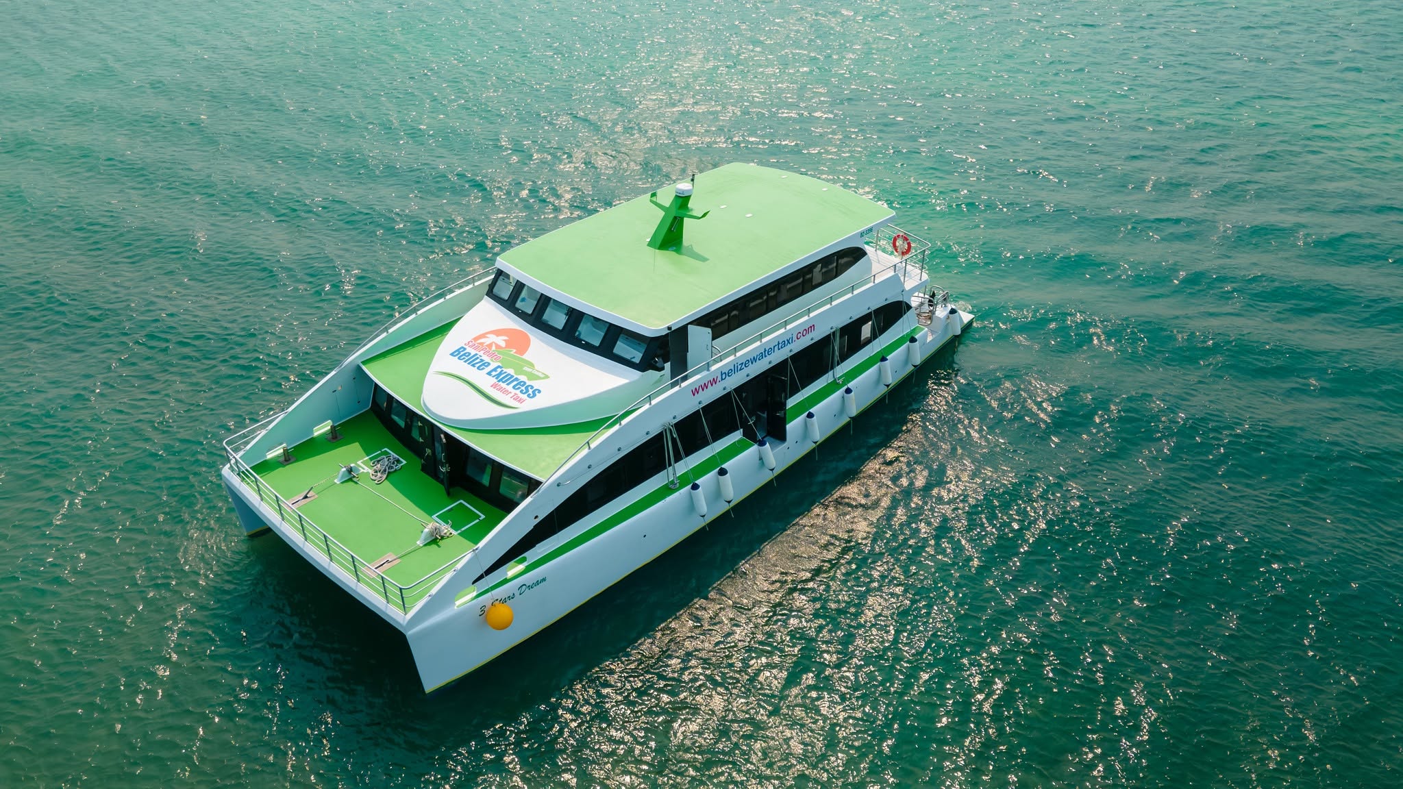 Aerial view of a charter catamaran in turquoise water